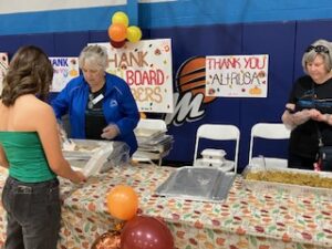 Altrusa Volunteers serving early Thanksgiving at Boys & Girls Club 